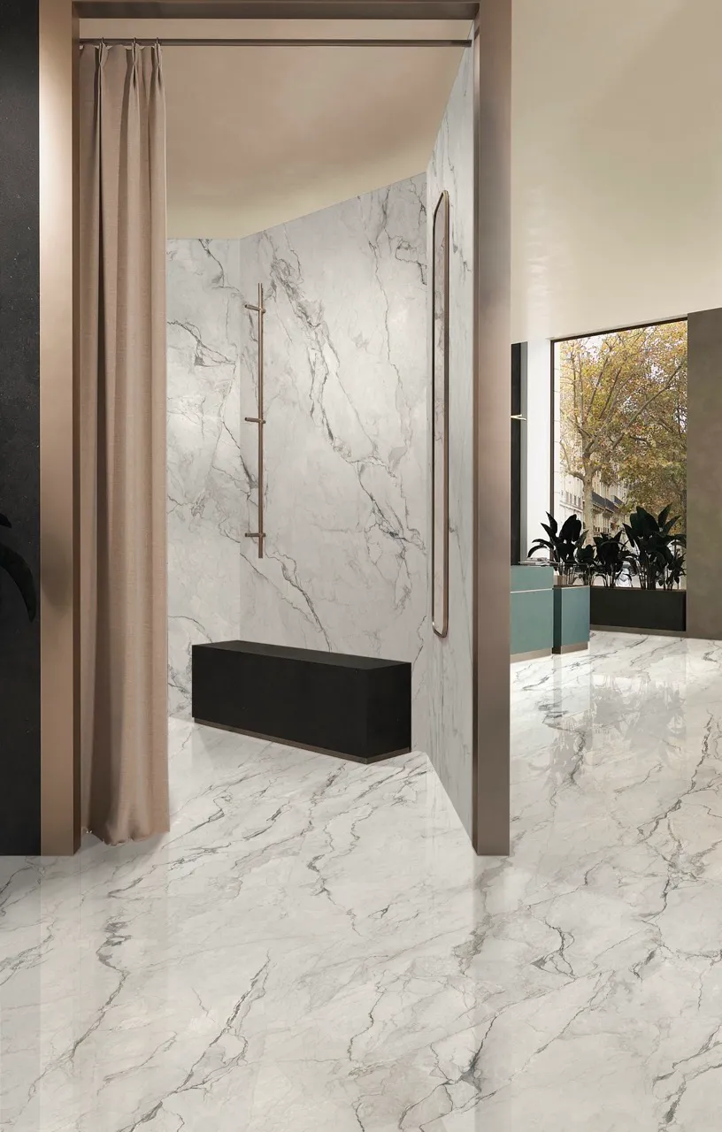 White Marble Look Glossy Sintered Stone Showroom Flooring Application