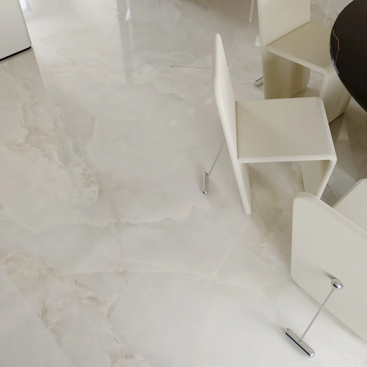 close-up of glossy white onyx look sintered stone flooring with polished surface and soft translucent texture