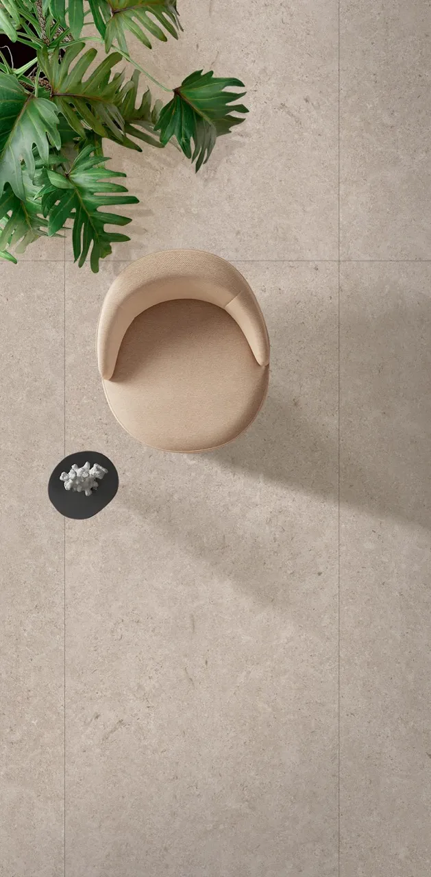 close up of beige limestone look sintered stone floor surface with matte finish