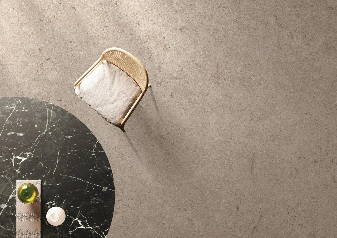 beige limestone look sintered stone flooring in contemporary interior space