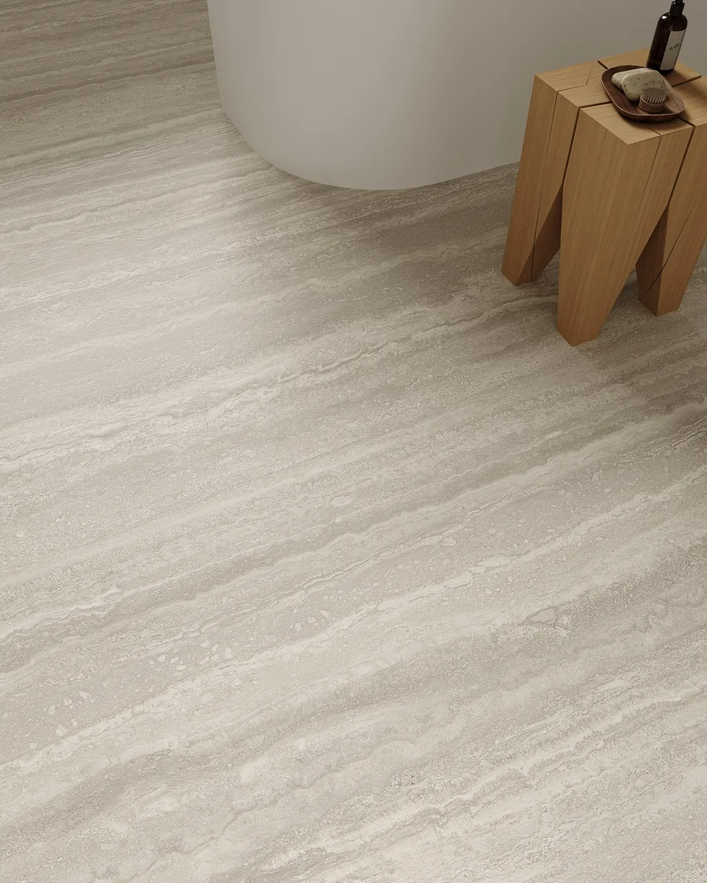 close up of gray travertine look sintered stone flooring with matte textured finish