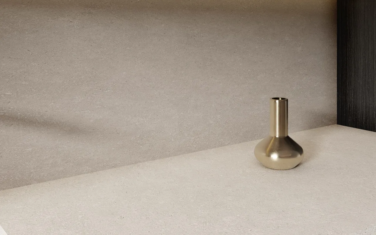 Close-up detail of warm gray limestone look sintered stone with glint lappato finish