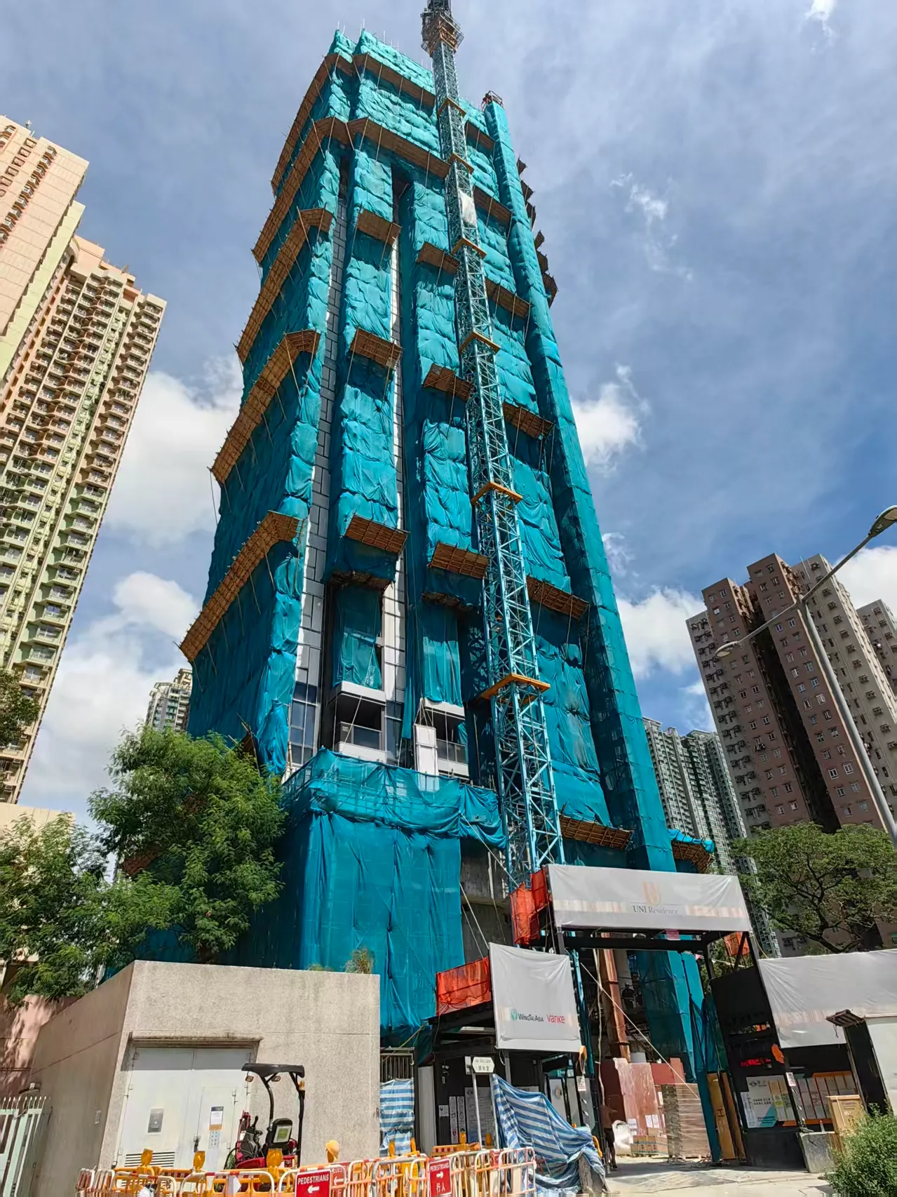 High-rise residential building under construction at the Hin Wo Lane project in Sha Tin, Hong Kong.