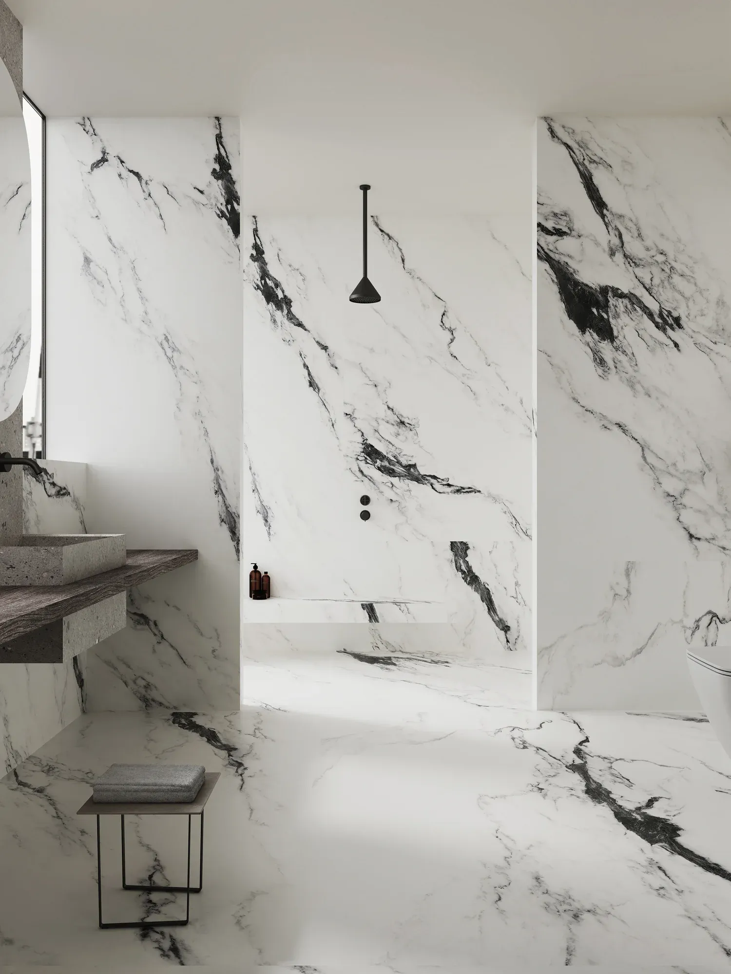 Ink Silence white and black sintered stone used in a black-veined bathroom wall and floor