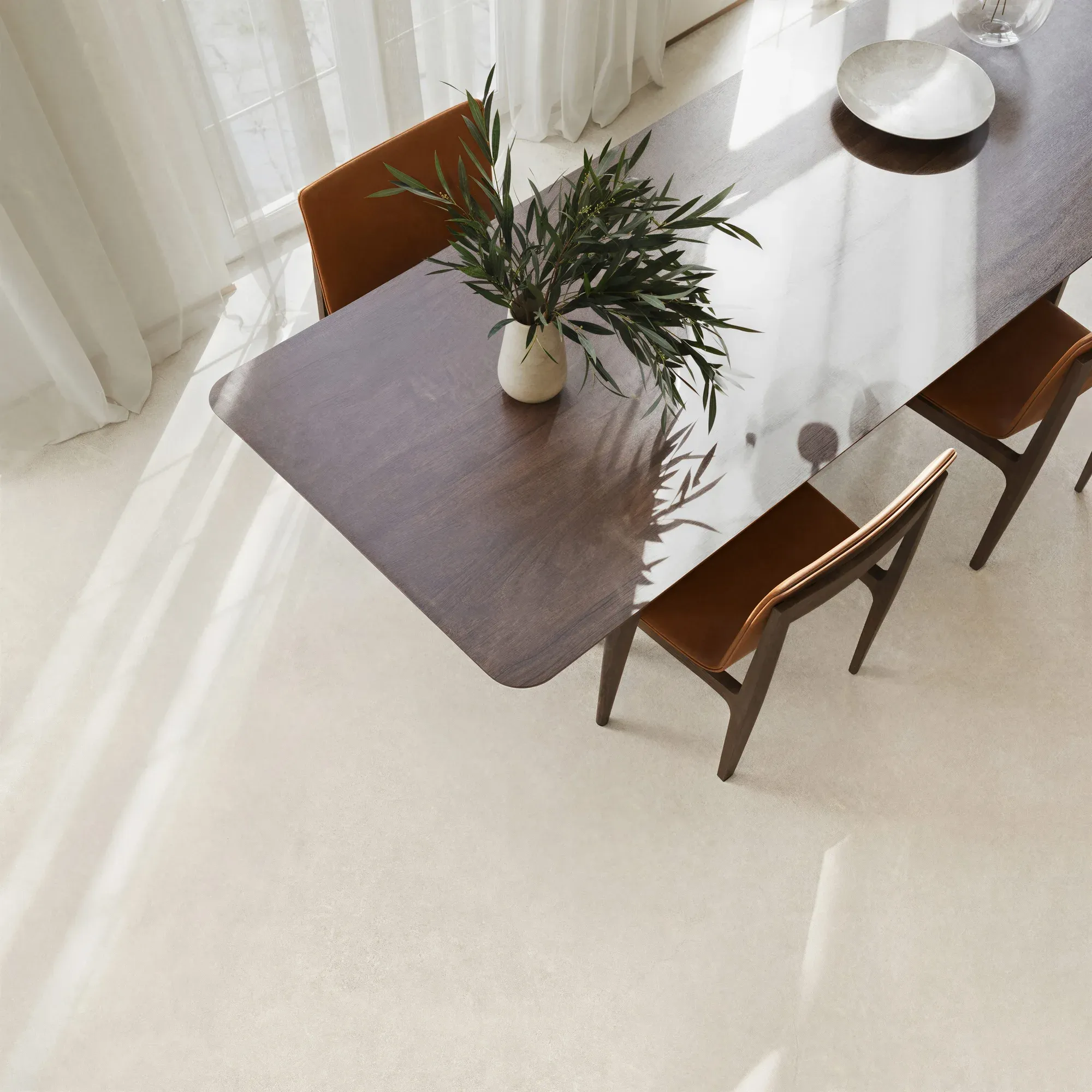 Portland White ivory white sintered stone used in a dining area floor detail