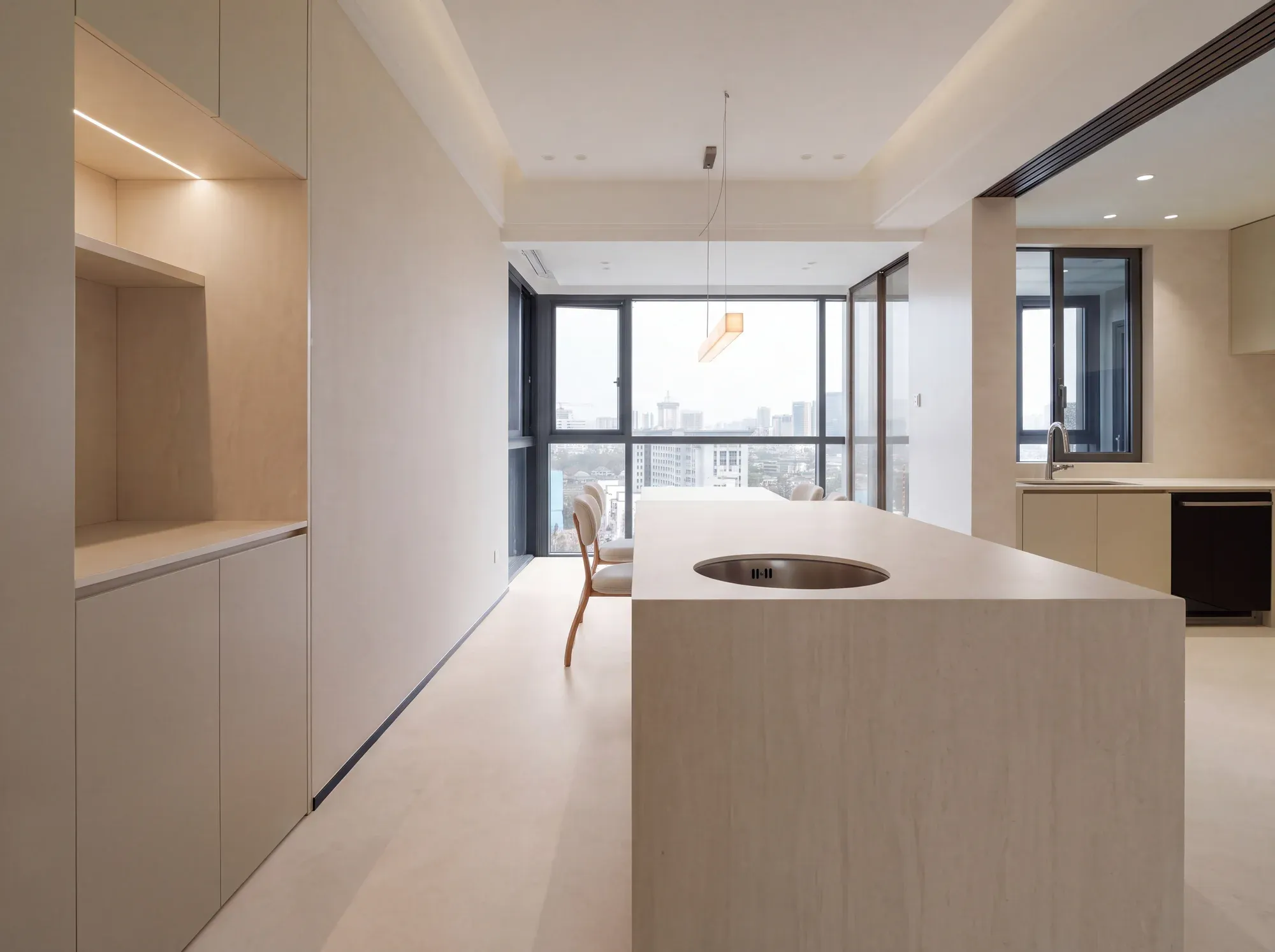 Veil Perla ivory sintered stone used in a kitchen island and floor